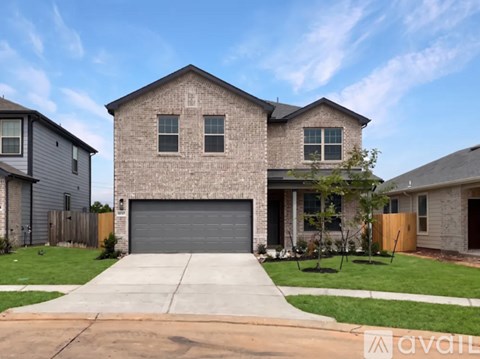 A house with a garage is available for sale.