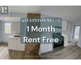 A real estate advertisement for a property at 45 Clinton St. offering a 1 month rent-free period.