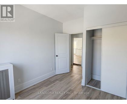 A room with a white door and a white cabinet.