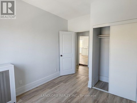 A room with a white door and a white cabinet.