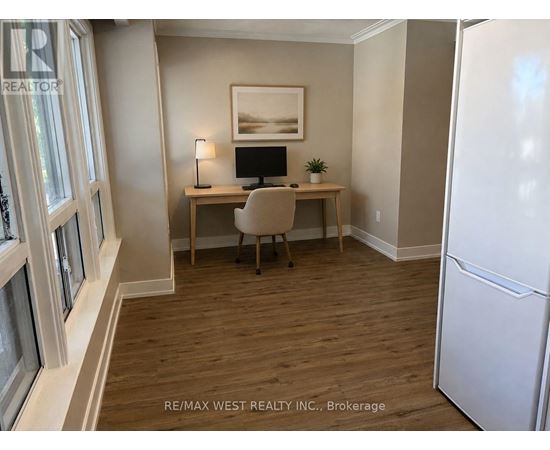 A room with a desk and chair in it.