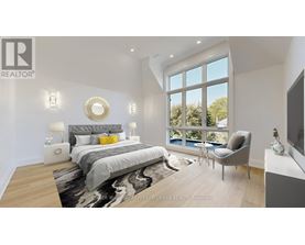 A bedroom with a large bed and a chair by the window.