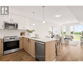A modern kitchen with wooden cabinets and stainless steel appliances.