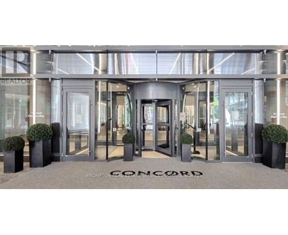 The front of a building with the word Concord written on the ground.