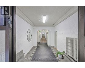 A hallway with a sign that says "HOMEWISSE REAL ESTATE Brokerage".