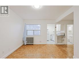 A room with a window and a radiator.