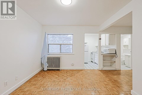 A room with a window and a radiator.