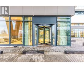 The image shows the front of a building with glass doors and windows, and a number 30 above the doors.