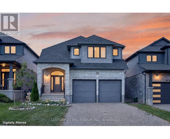A house with a garage and a driveway in front of it.