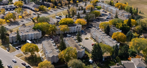 A residential area with houses and trees.