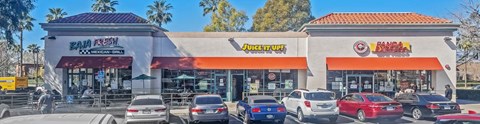A Baja Fresh Mexican Grill and a Juice It Up! store are located next to each other.