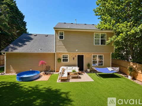 A house with a pool in the backyard.