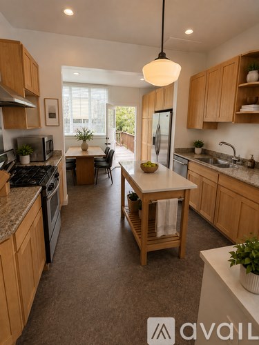 A kitchen with wooden cabinets and a central island.