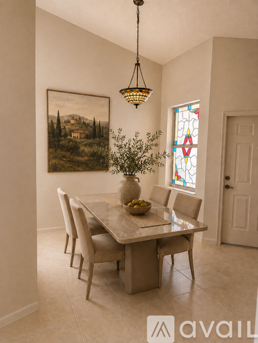 A dining room with a table set for four.