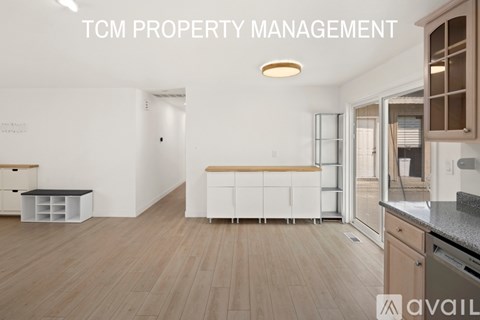 A kitchen area with a counter and cabinets.