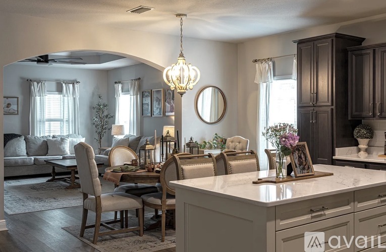 A well-lit dining area with a table set for six.