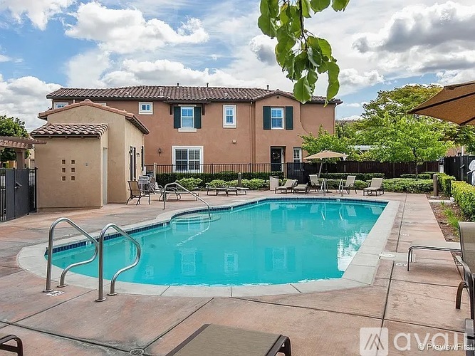 A house with a pool in the backyard.
