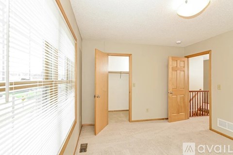 A kitchen with wooden cabinets and stainless steel appliances.