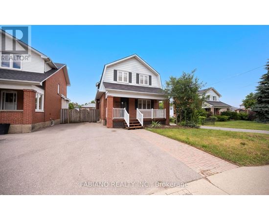 A house with a driveway in front of it.