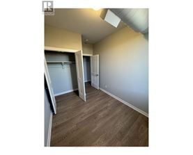 A room with a sliding door and a closet.