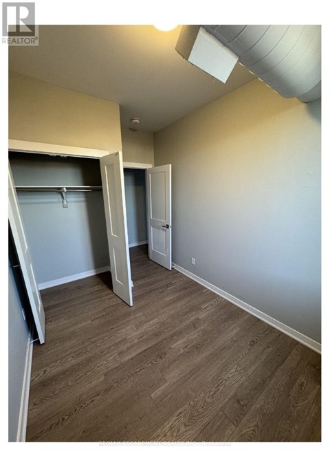 A room with a sliding door and a closet.