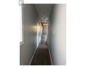 A long hallway with a light at the end.
