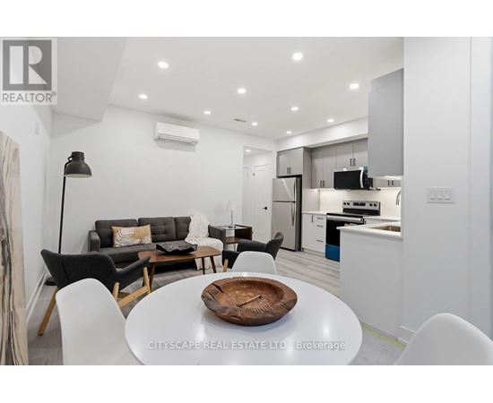 A modern kitchen with a dining table set in the middle.