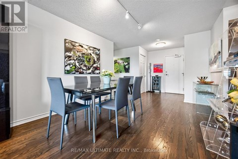 A dining room with a table set for four.