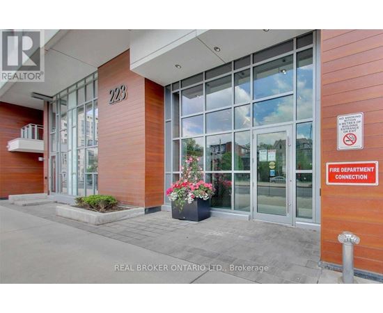The entrance to a building with a fire department connection sign.