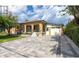 A house with a driveway in front of it is for sale.