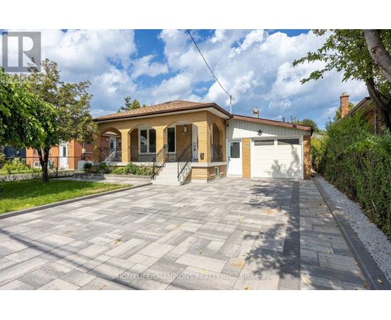 A house with a driveway in front of it is for sale.