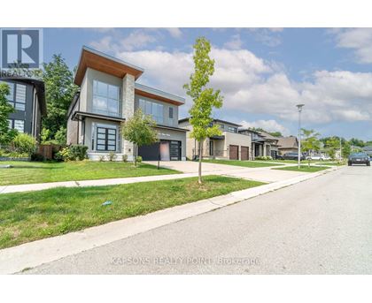 A row of houses with the logo "KAPSONS REALTY POINT" on the bottom left.