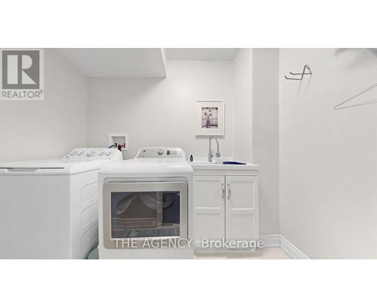 A white fridge and oven in a small kitchen.