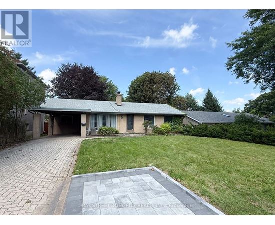 A house with a driveway in front of it.