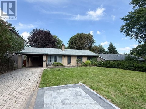 A house with a driveway in front of it.