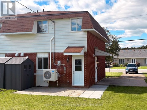 A house with a red roof and a white door is shown.
