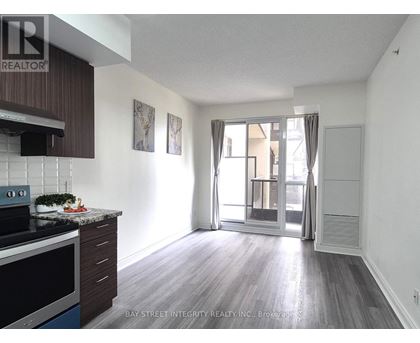 A kitchen with a stove top oven and a counter top.