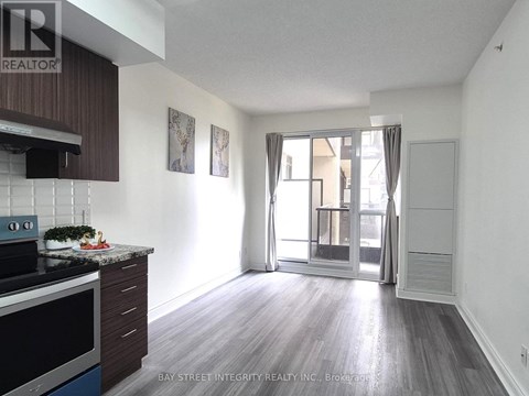 A kitchen with a stove top oven and a counter top.