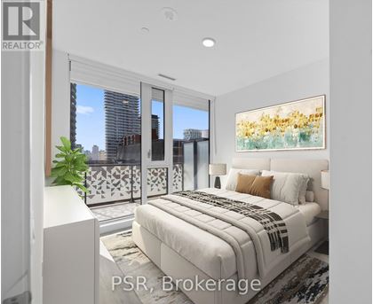 A bedroom with a large bed and a view of the city.