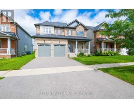 A house with a driveway in front of it.