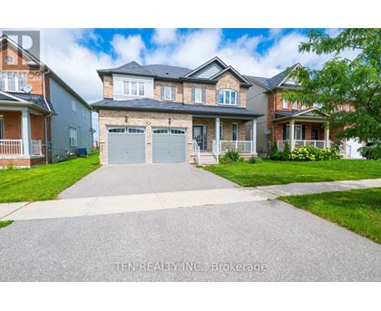 A house with a driveway in front of it.
