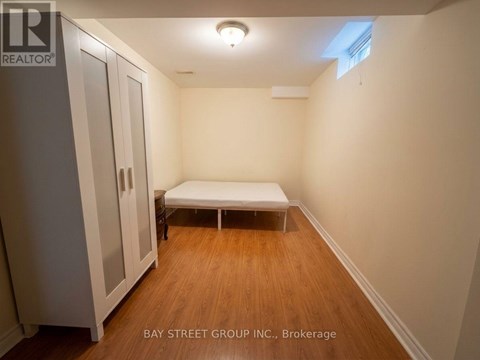 A bedroom with a bed and a wardrobe.