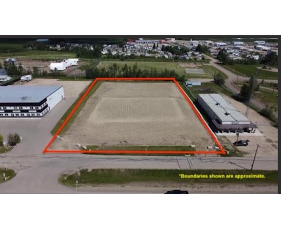 An aerial view of a field with a red boundary line.