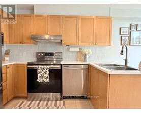 A kitchen with wooden cabinets and a black stove top oven.