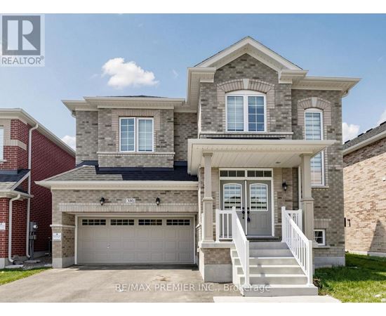 A two-story house with a garage is for sale.