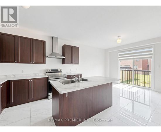 A kitchen with brown cabinets and a white counter top.