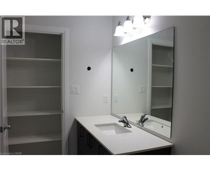 A bathroom with a sink, mirror and medicine cabinet.