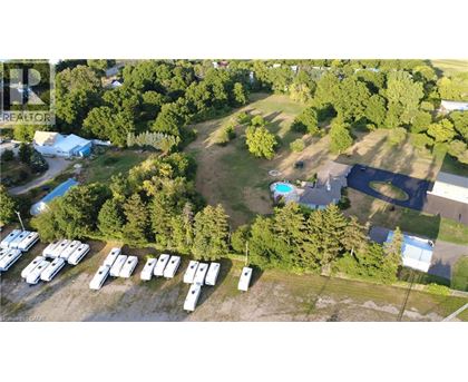 A bird's eye view of a camping site with a swimming pool and a parking lot.