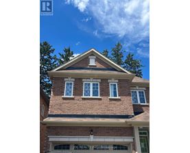 A house with a sign that says "DL Realty Inc, Brokerage".