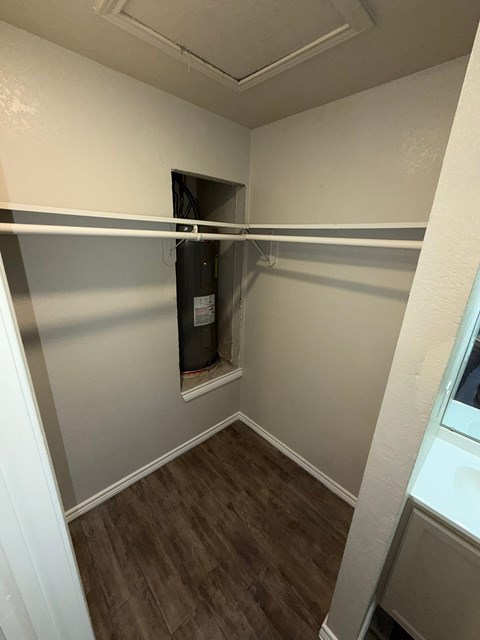 A small, empty room with a doorway to another room.